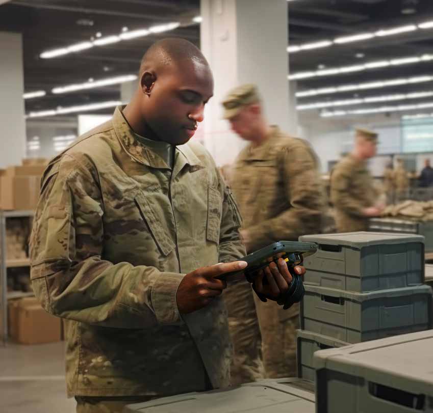 Service member using a rugged handheld device in a military logistics setting